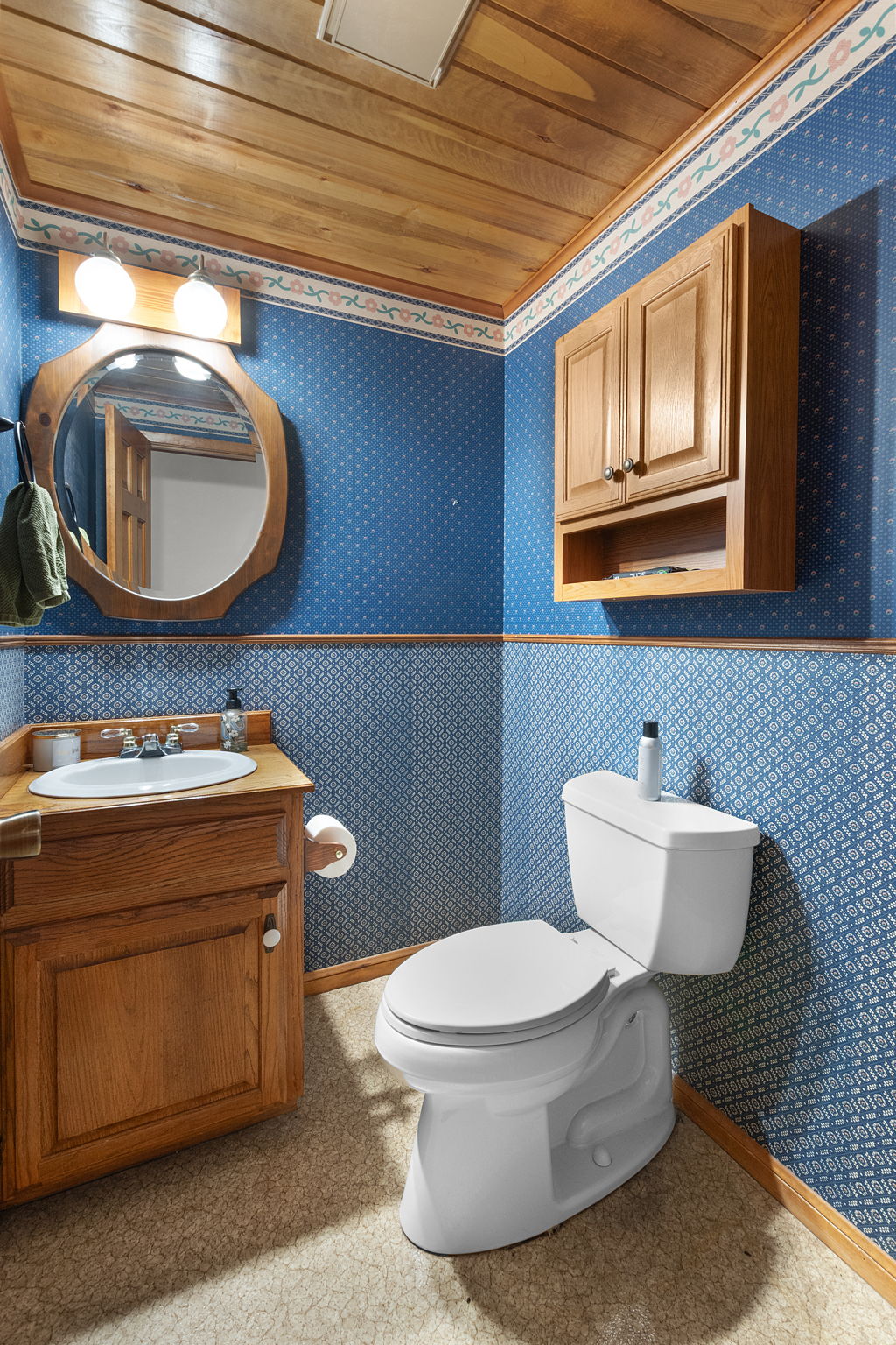 124 Old Mission Road Kempner, TX 76539 - Photo 21 of 40 a bathroom with a toilet a sink and mirror