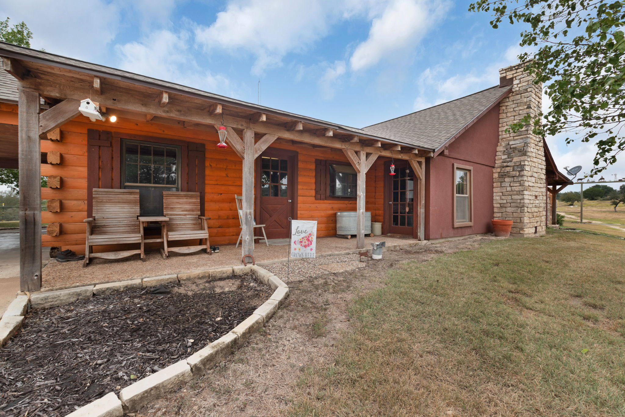 124 Old Mission Road Kempner, TX 76539 - Photo 28 of 40 a view of a house with large windows and lawn chairs