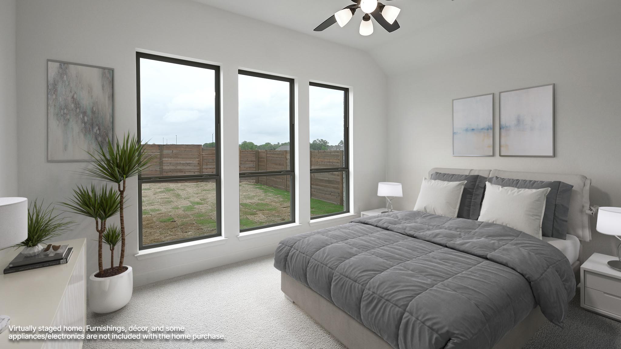 3921 Melody Road Lockhart, TX 78644 - Photo 5 of 30 a bedroom with a large bed and a potted plant