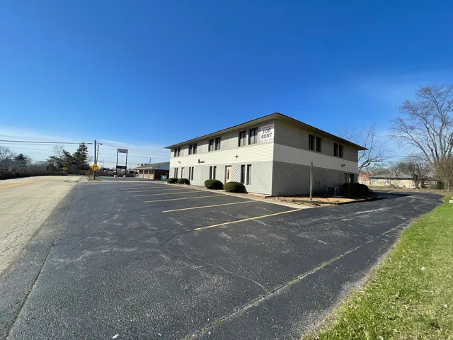 a view of a street with an ocean view