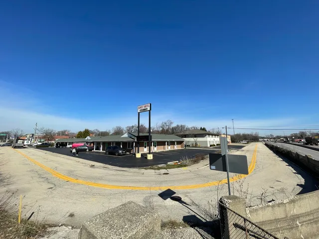 a view of a swimming pool with a lounge chair
