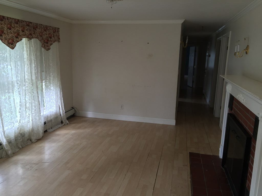 9 Kanehoe Court Townsend, MA 01474 - Photo 3 of 4 a view of a closet area with a fireplace