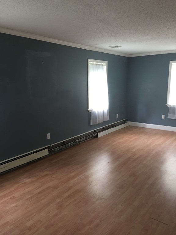 9 Kanehoe Court Townsend, MA 01474 - Photo 4 of 4 an empty room with a empty space and window