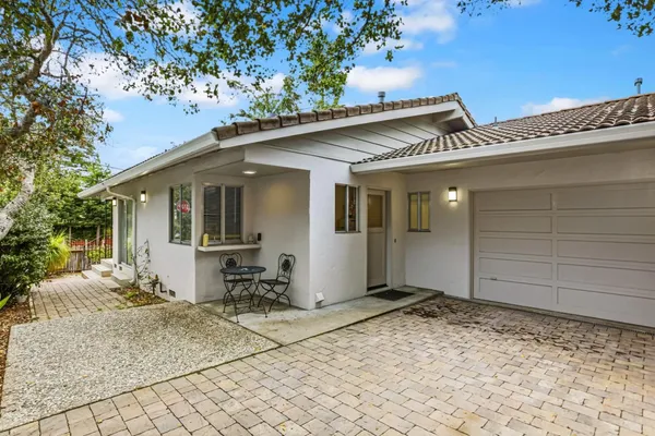 a backyard of a house with seating space