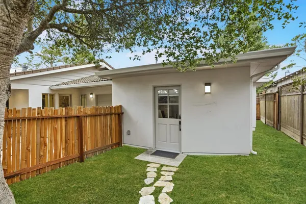 a backyard of a house with lots of green space