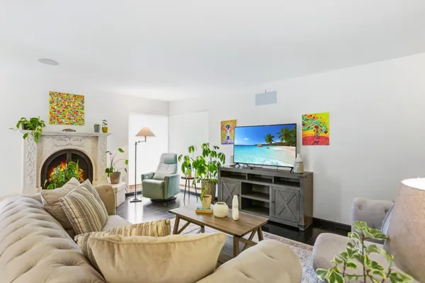 a living room with furniture and a fireplace