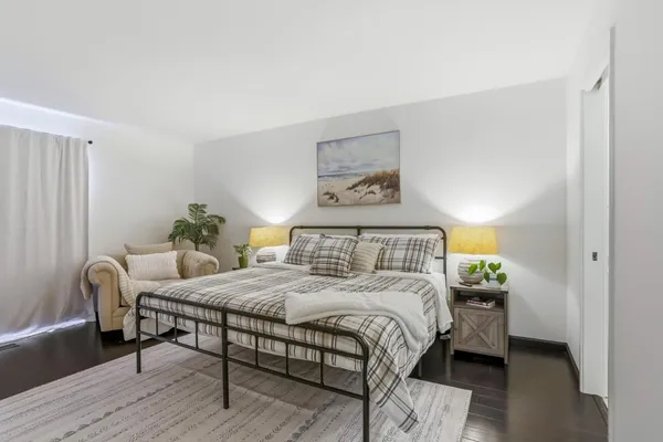 a bedroom with a bed and a table