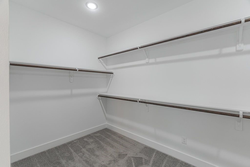 15038 Wunderlust Houston, TX 77069 - Photo 14 of 27 a view of an empty walk in closet