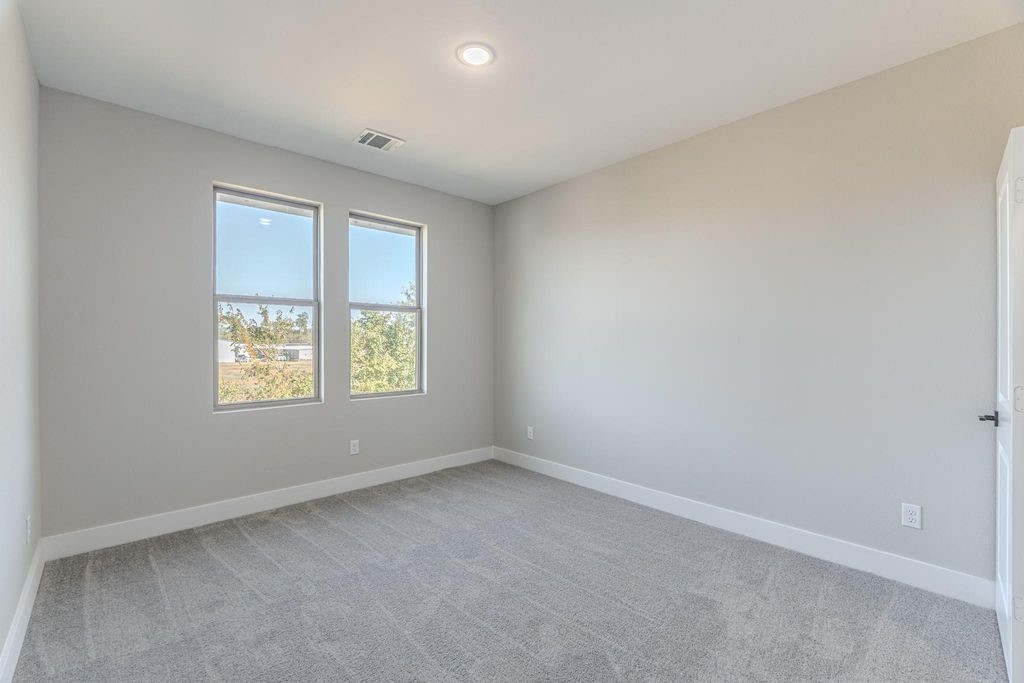 15038 Wunderlust Houston, TX 77069 - Photo 21 of 27 an empty room with windows