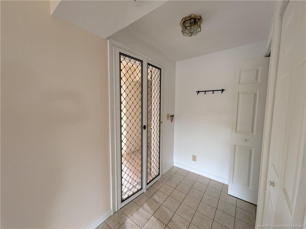 3100 Southeast Pruitt Road, Unit B301 Port St. Lucie, FL 34952 - Photo 16 of 40 Magnetic screen door for cross breezes