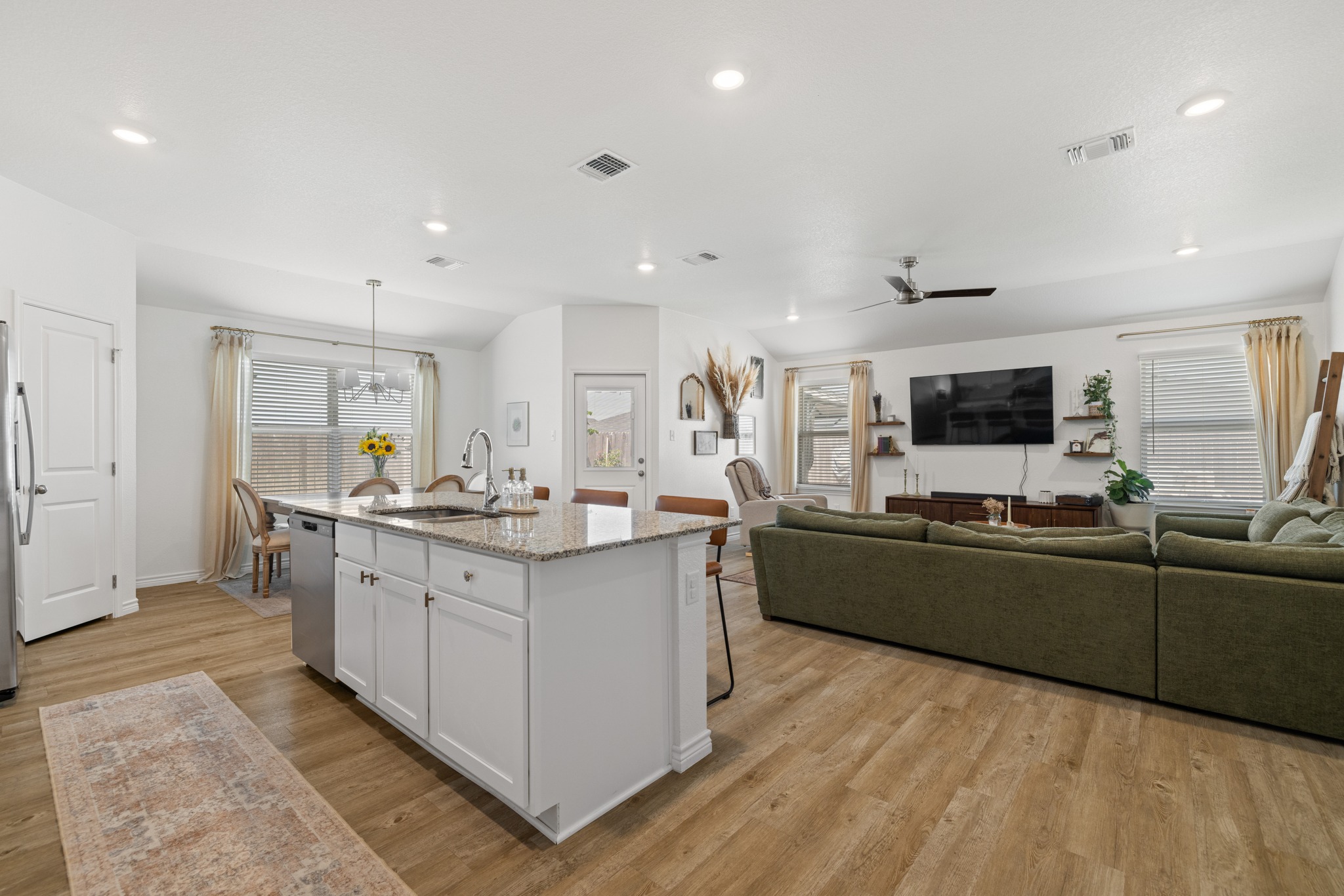 129 Maybelline Road Jarrell, TX 76537 - Photo 28 of 28 An open floor plan seamlessly connects the kitchen island to the inviting living area.
