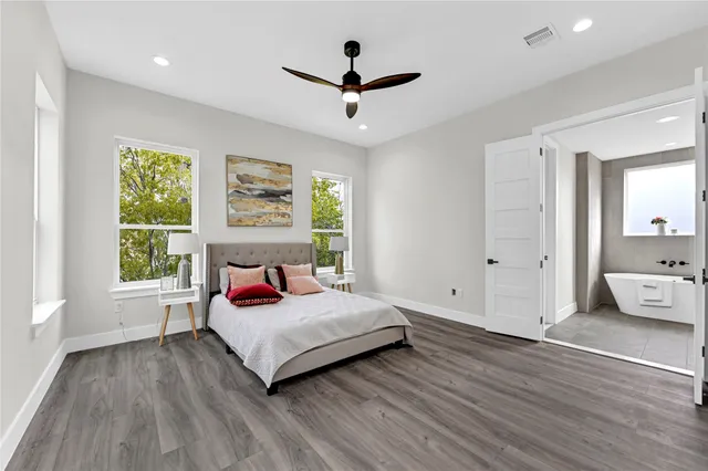 a bedroom with a bed and window