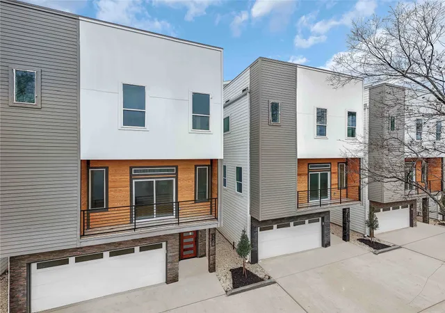 a front view of a house with large windows