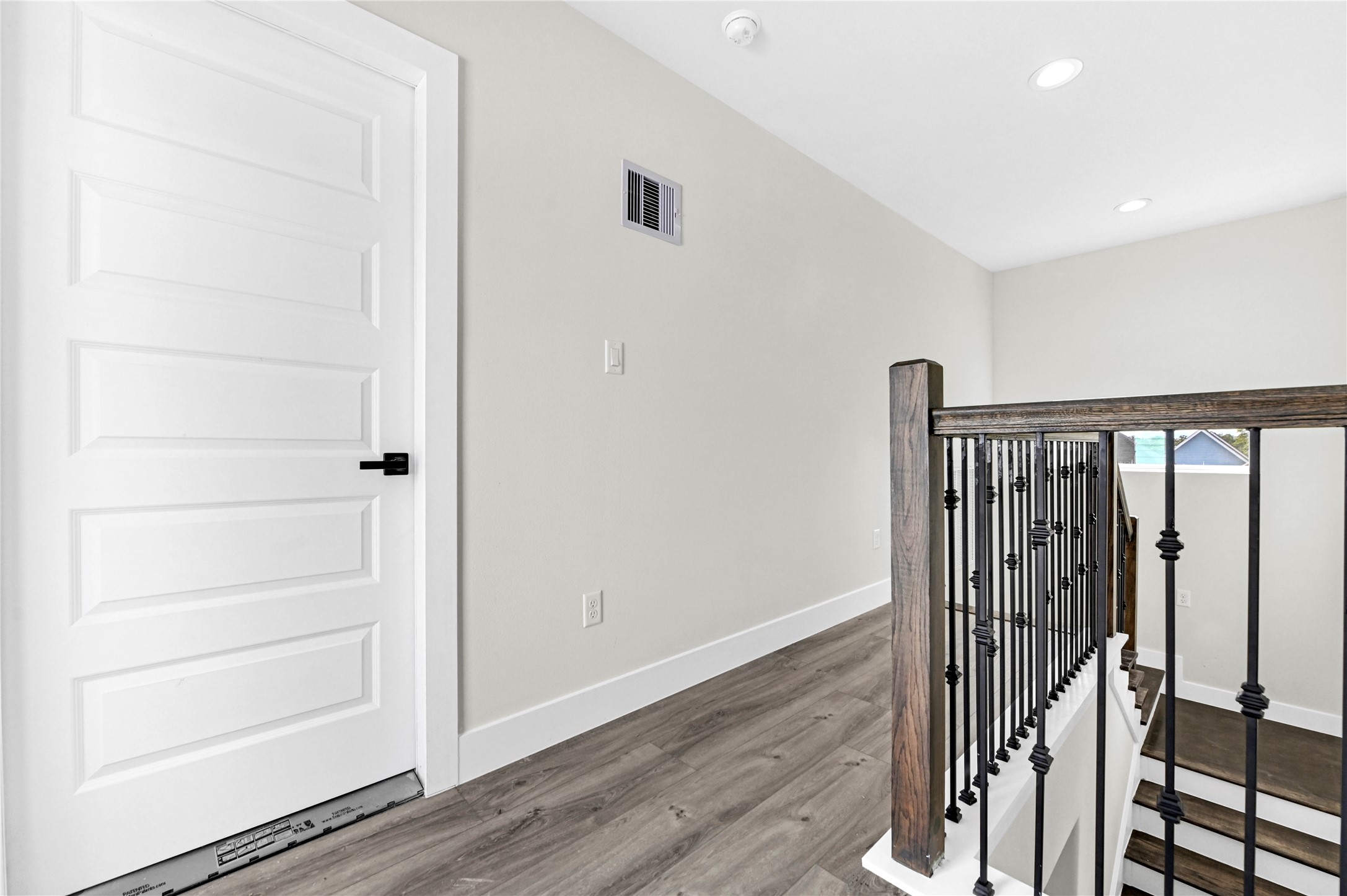 710 Link Road, Unit B Houston, TX 77009 - Photo 24 of 31 a view of a hallway with wooden floor