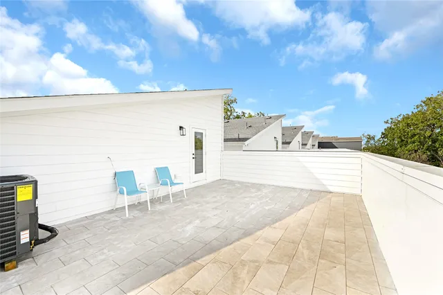 a view of a terrace with chairs