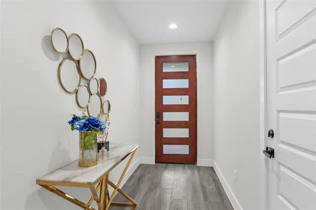 a room with furniture and wooden floor