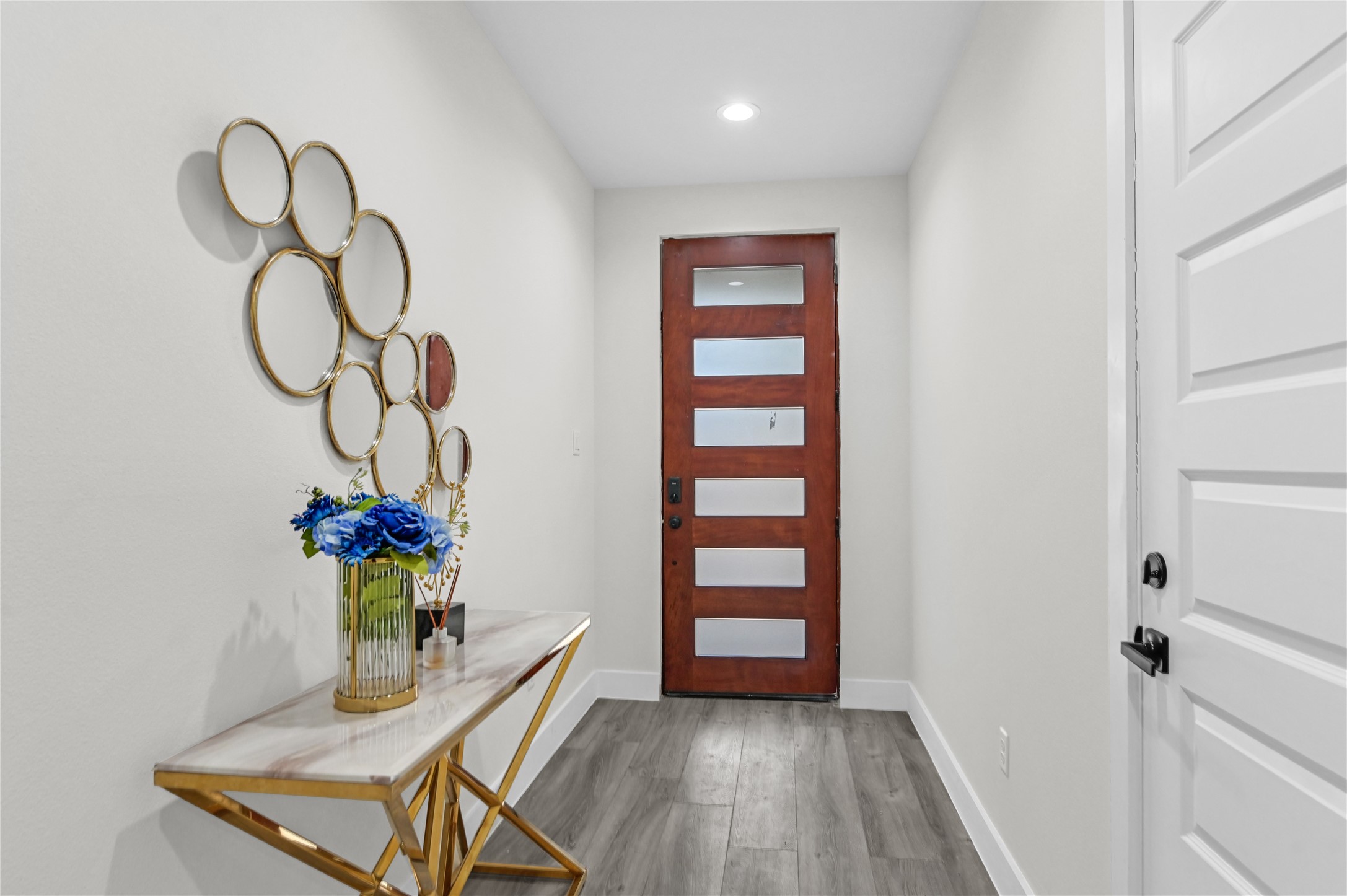 710 Link Road, Unit B Houston, TX 77009 - Photo 4 of 31 a room with furniture and wooden floor