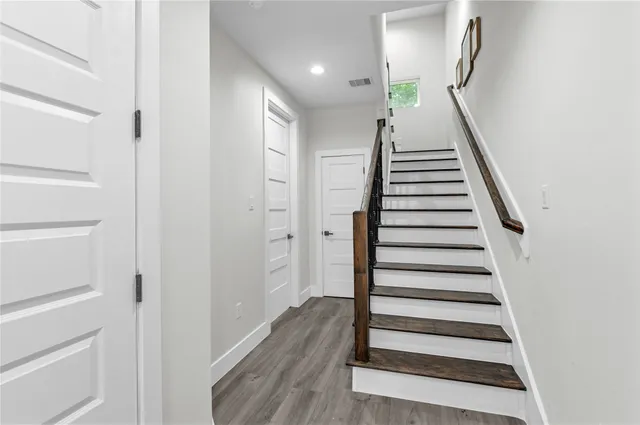 a view of entryway with wooden floor
