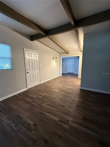 a view of a livingroom with wooden floor