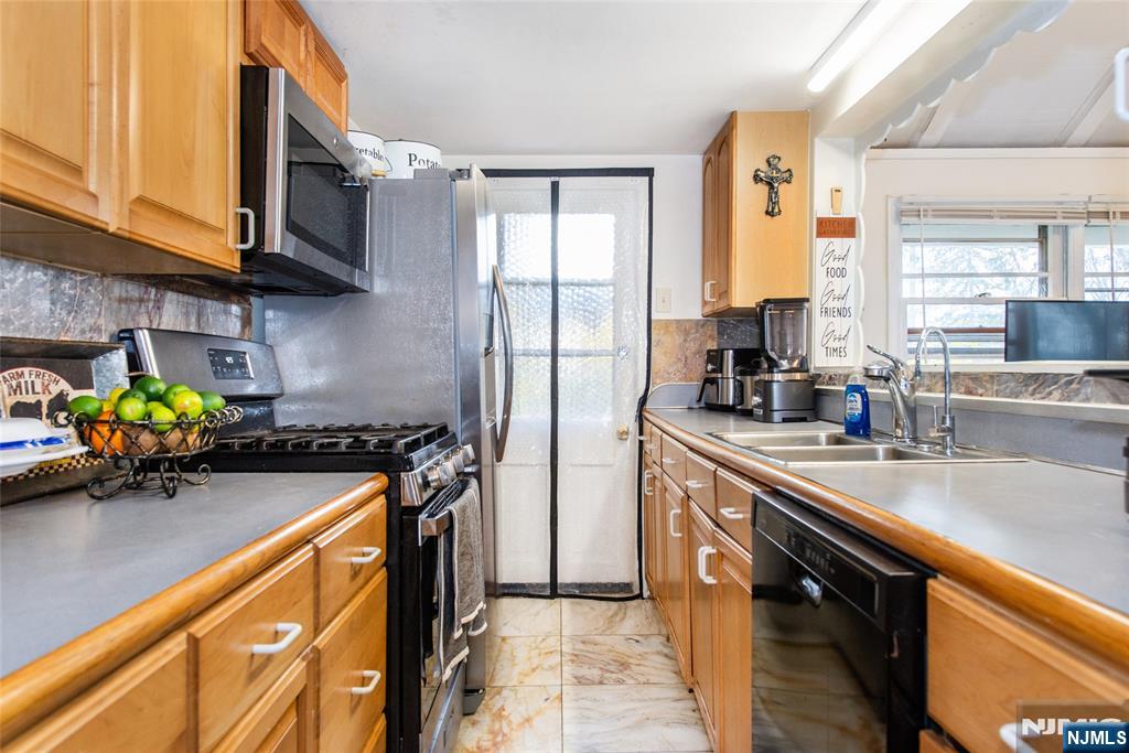 47 Hillside Road Sparta, NJ 07871 - Photo 13 of 25 a kitchen with stainless steel appliances granite countertop sink stove top oven and cabinets