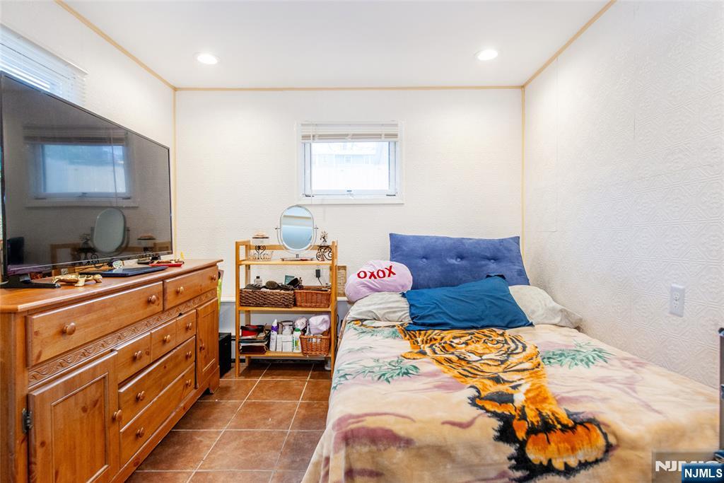 47 Hillside Road Sparta, NJ 07871 - Photo 20 of 25 a bed room with a bed and a window