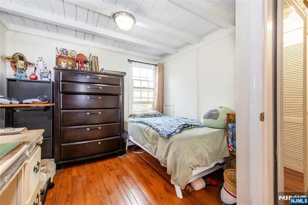 a bed room with a bed and a window
