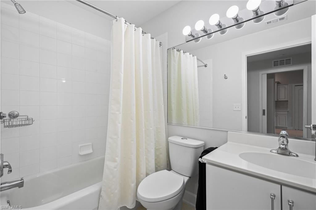 2870 Cypress Trace Circle, Unit 1723 Naples, FL 34119 - Photo 17 of 33 a bathroom with a sink a toilet and shower