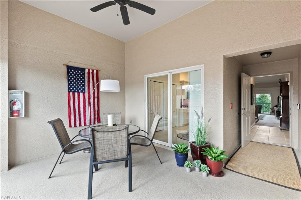 2870 Cypress Trace Circle, Unit 1723 Naples, FL 34119 - Photo 19 of 33 a view of a livingroom with furniture and a potted plant