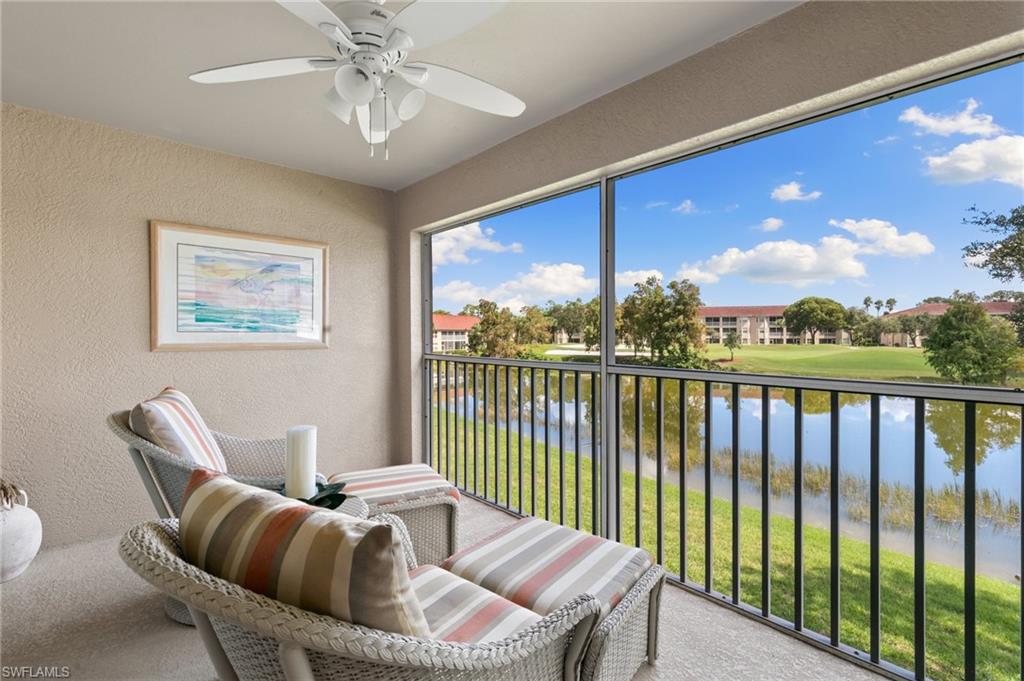 2870 Cypress Trace Circle, Unit 1723 Naples, FL 34119 - Photo 2 of 33 a balcony with furniture