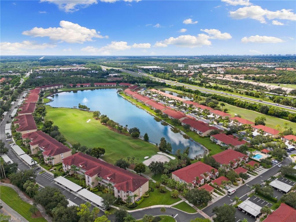 2870 Cypress Trace Circle, Unit 1723 Naples, FL 34119 - Photo 24 of 33 an aerial view of residential houses with outdoor space