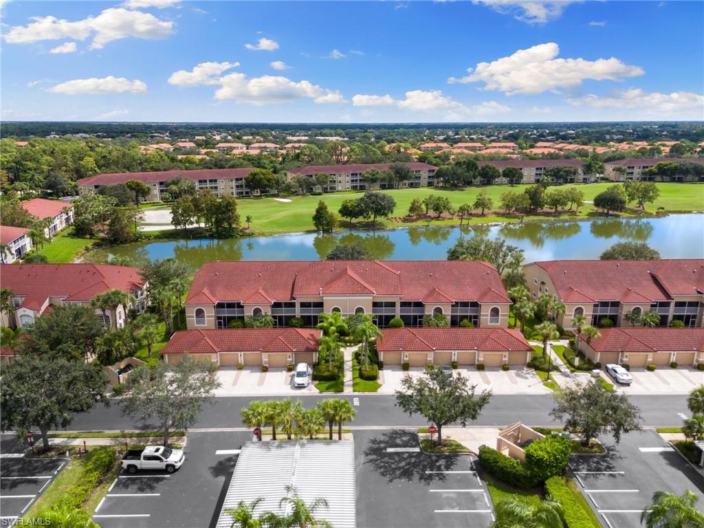 2870 Cypress Trace Circle, Unit 1723 Naples, FL 34119 - Photo 25 of 33 an aerial view of a city with lots of residential buildings ocean and mountain view in back