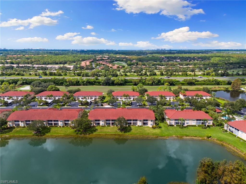 2870 Cypress Trace Circle, Unit 1723 Naples, FL 34119 - Photo 27 of 33 a view of a city with lots of residential buildings lake and ocean view