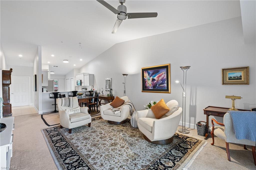 2870 Cypress Trace Circle, Unit 1723 Naples, FL 34119 - Photo 3 of 33 a living room with furniture and a rug