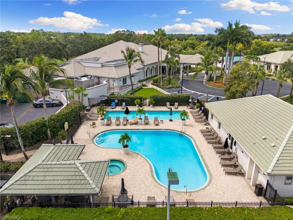 2870 Cypress Trace Circle, Unit 1723 Naples, FL 34119 - Photo 32 of 33 an aerial view of residential houses with outdoor space and seating area