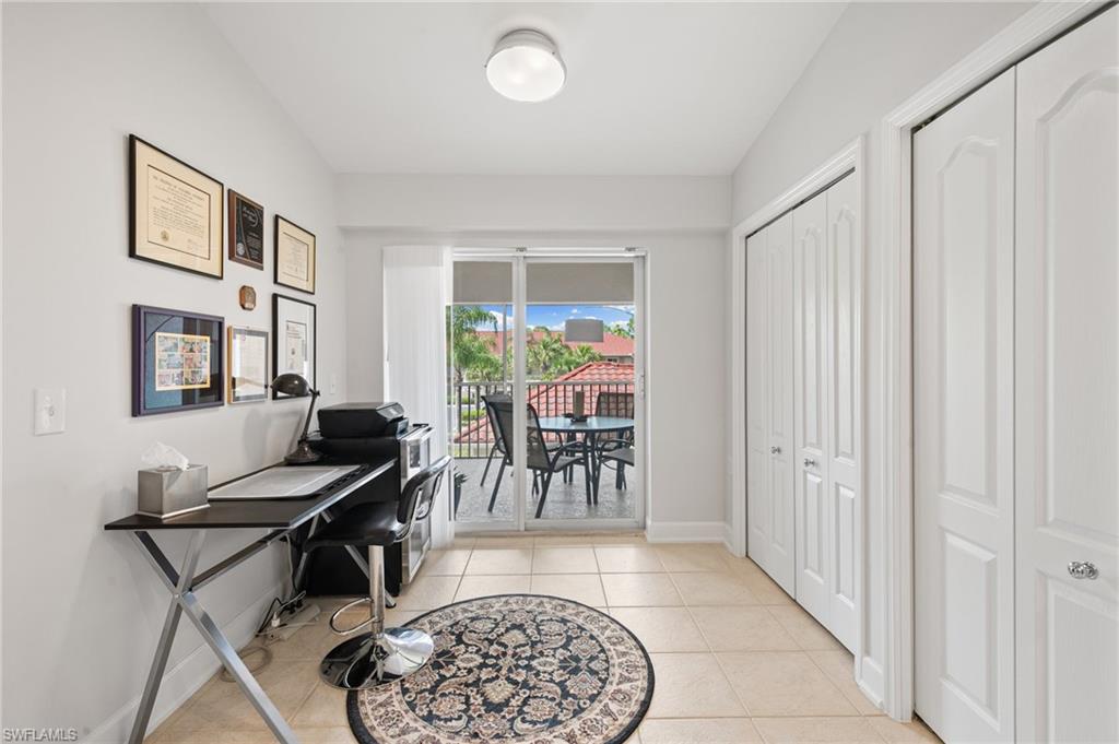 2870 Cypress Trace Circle, Unit 1723 Naples, FL 34119 - Photo 10 of 33 a view of a livingroom with furniture and a rug