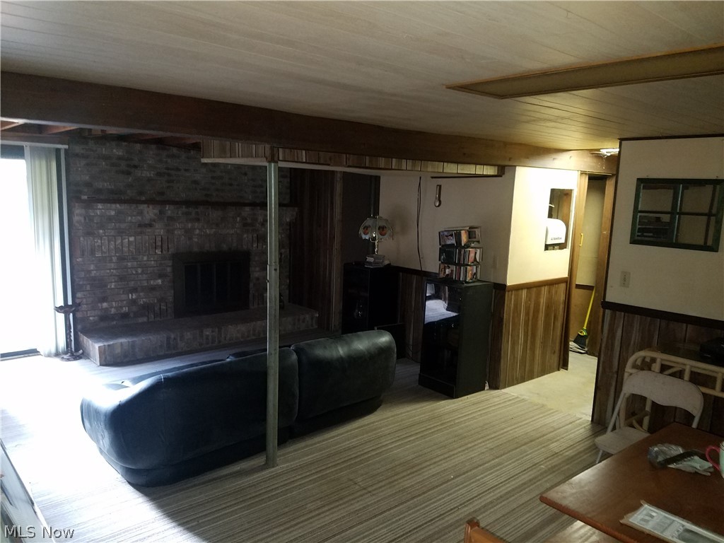617 Whitney Road Conneaut, OH 44030 - Photo 15 of 19 Reck room, lower level. Sliding glass doors lead to back yard. Bathroom needs finished. Room for a 4th bedroom, laundry and access to garage is located on this level.