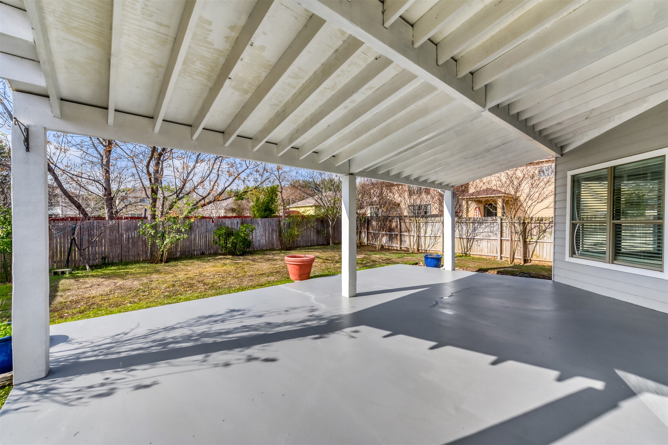 4508 Peach Grove Road Austin, TX 78744 - Photo 20 of 24 Fenced backyard with a patio
