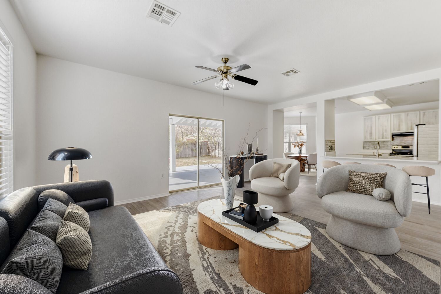 4508 Peach Grove Road Austin, TX 78744 - Photo 6 of 24 Living area with light wood-style flooring and a ceiling fan