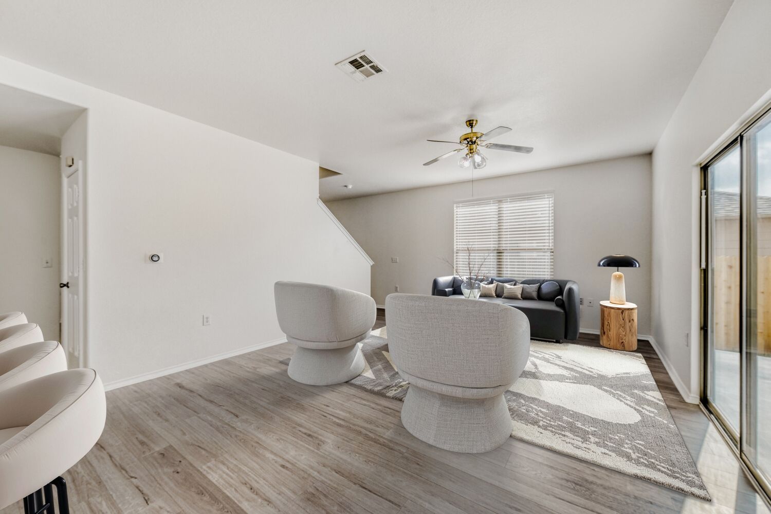 4508 Peach Grove Road Austin, TX 78744 - Photo 7 of 24 Living area featuring light wood finished floors, plenty of natural light, and a ceiling fan