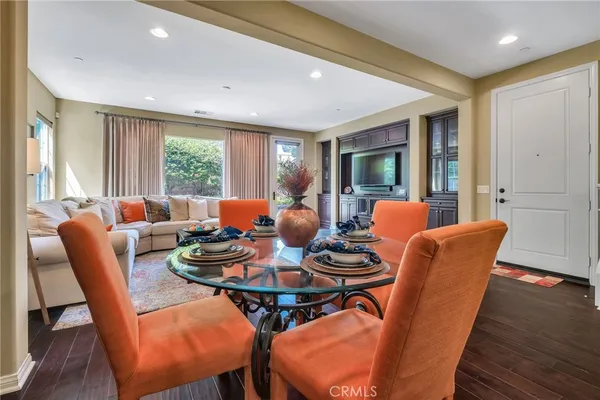 a kitchen with a table and chairs in it