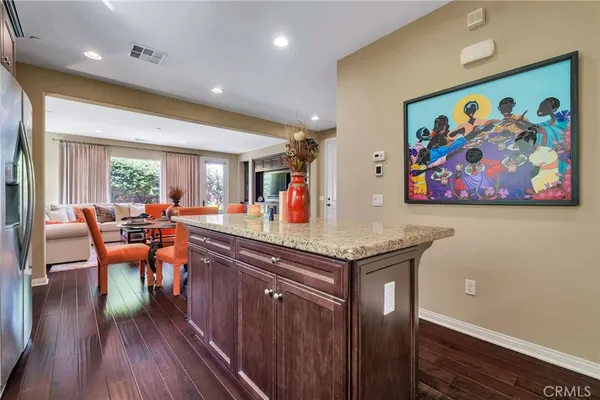 a kitchen with stainless steel appliances granite countertop a sink stove and microwave