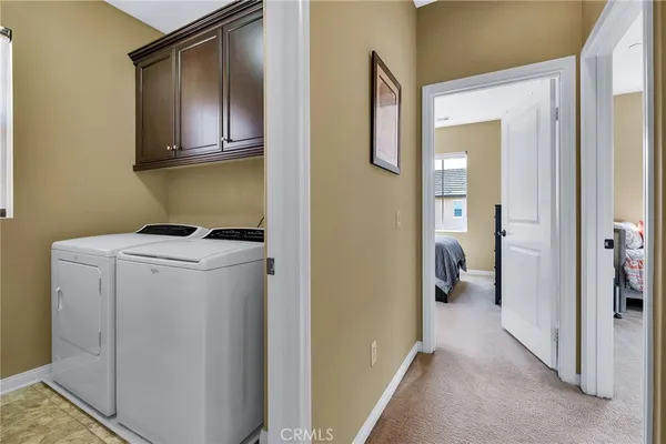 a bathroom with a granite countertop sink a large mirror and a bathtub
