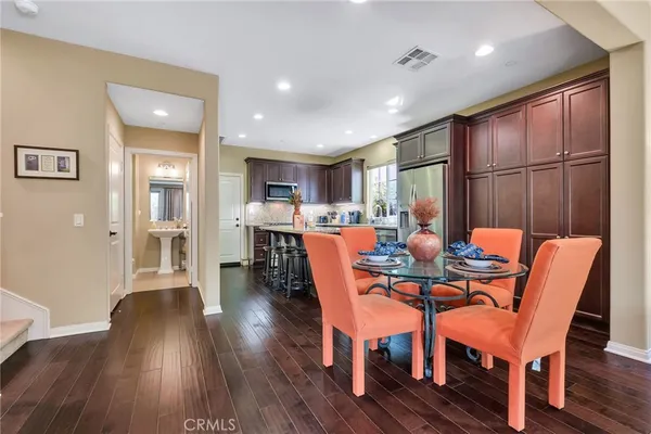 a view of a dining room with furniture window and wooden floor