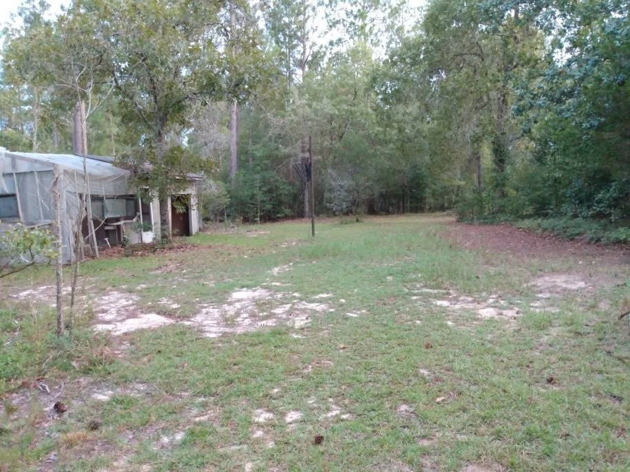 567 Cedar Road Aiken, SC 29803 - Photo 19 of 25 a backyard of a house with table and chairs