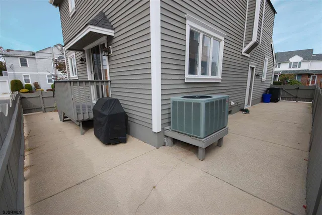 a view of a house with a yard and a garage