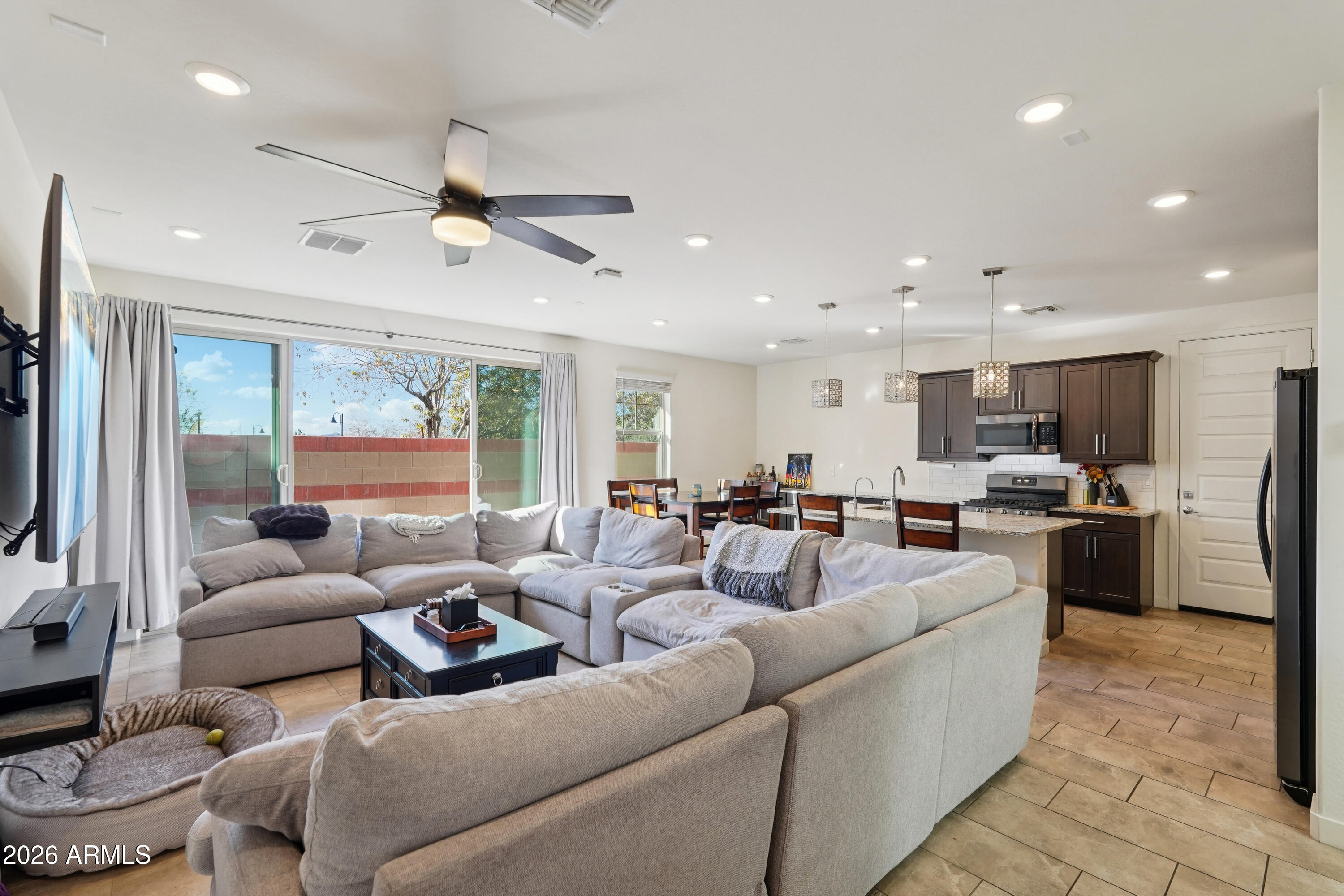 17153 North 10th Street Phoenix, AZ 85022 - Photo 11 of 48 a living room with furniture kitchen and a large window