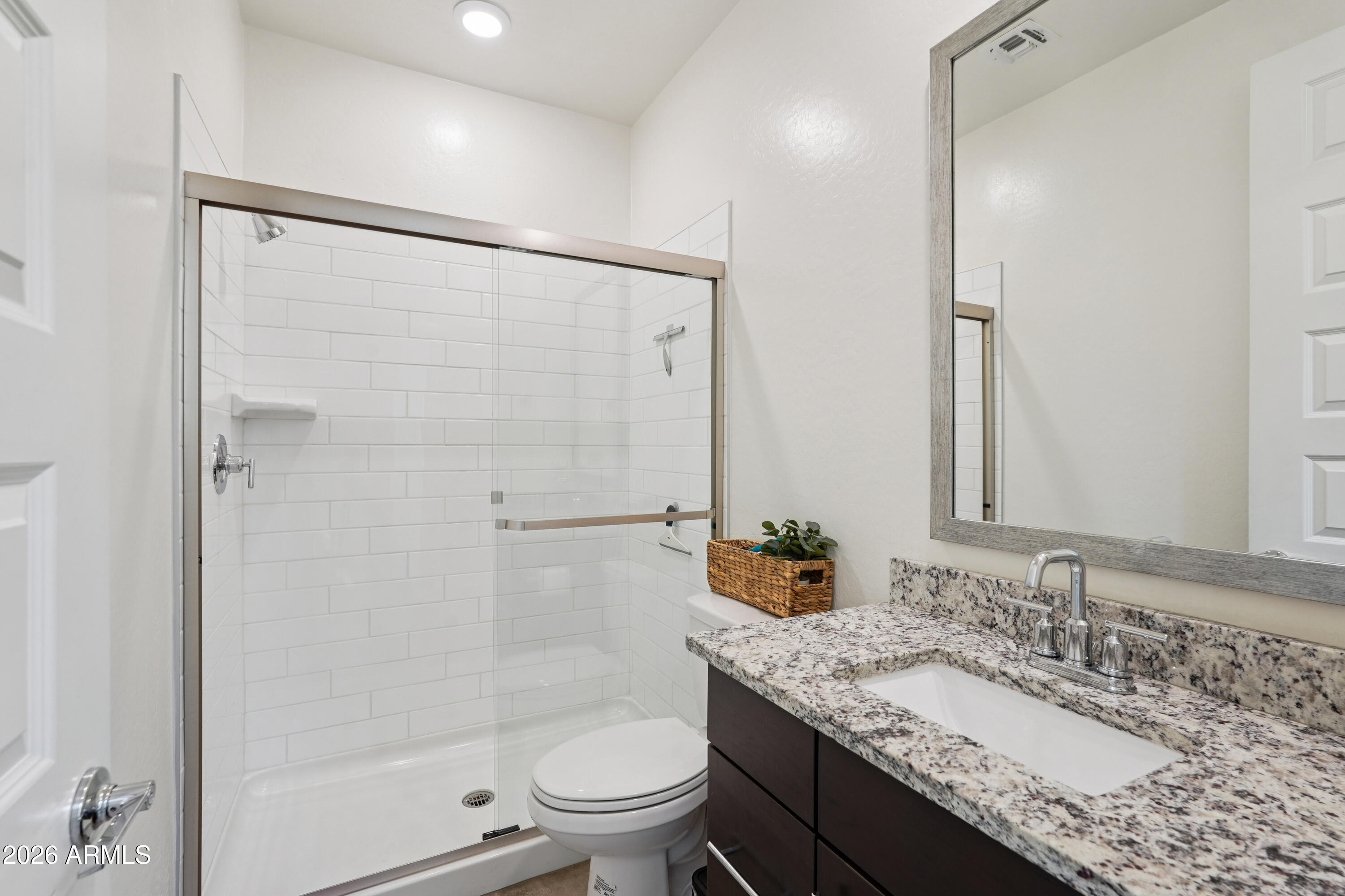 17153 North 10th Street Phoenix, AZ 85022 - Photo 19 of 48 a bathroom with a granite countertop sink toilet and shower