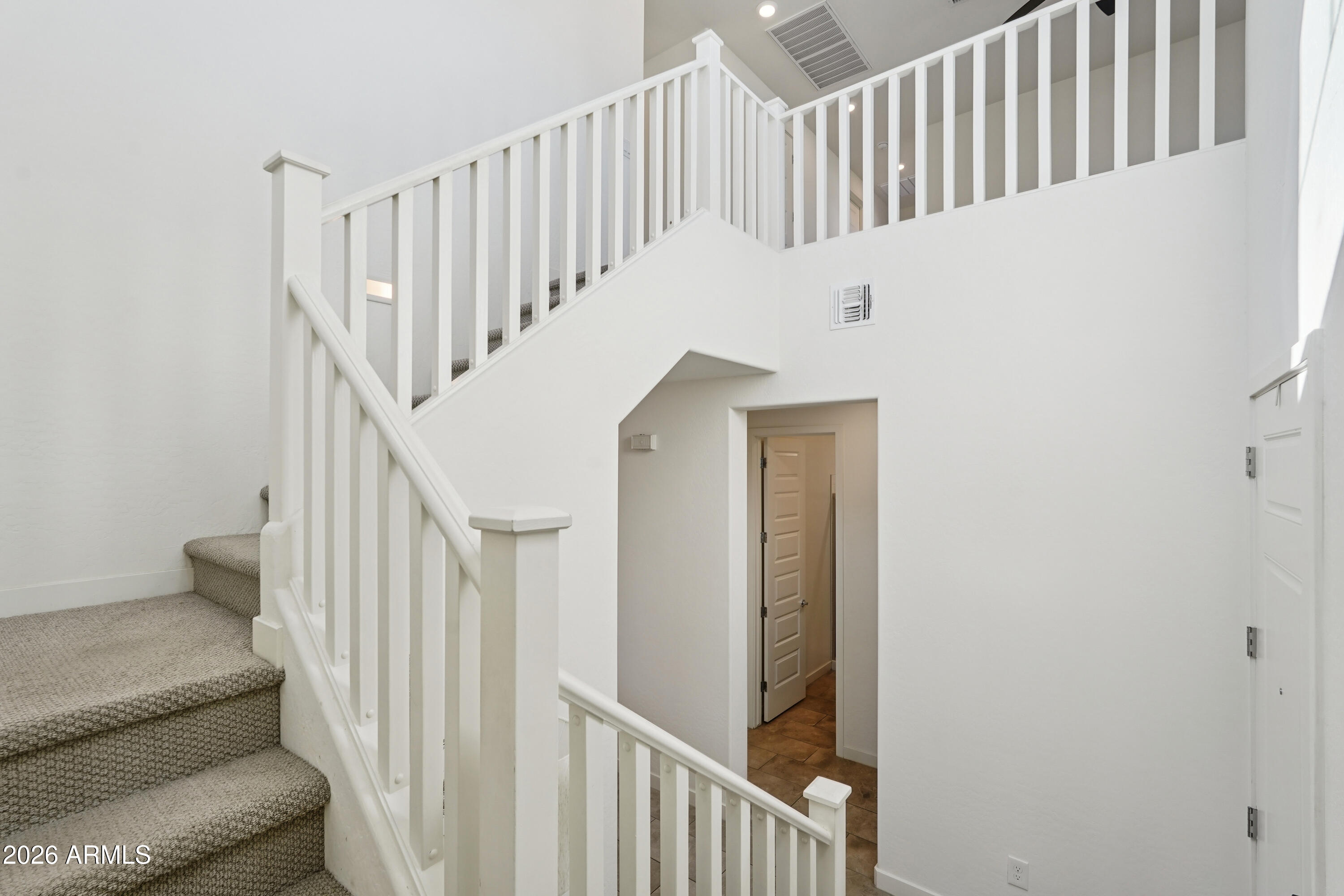 17153 North 10th Street Phoenix, AZ 85022 - Photo 20 of 48 a view of staircase with railing and white walls