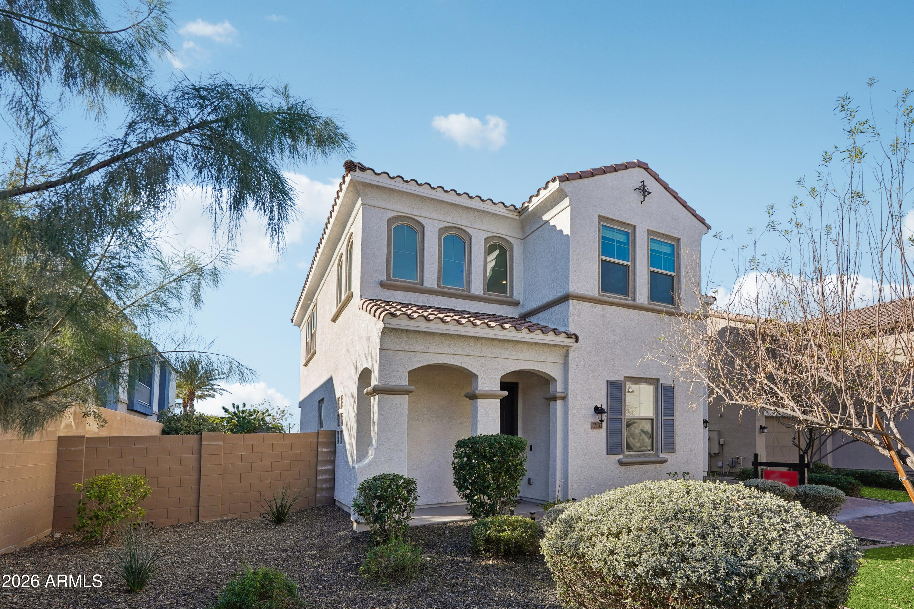 17153 North 10th Street Phoenix, AZ 85022 - Photo 2 of 48 a front view of a house with a yard