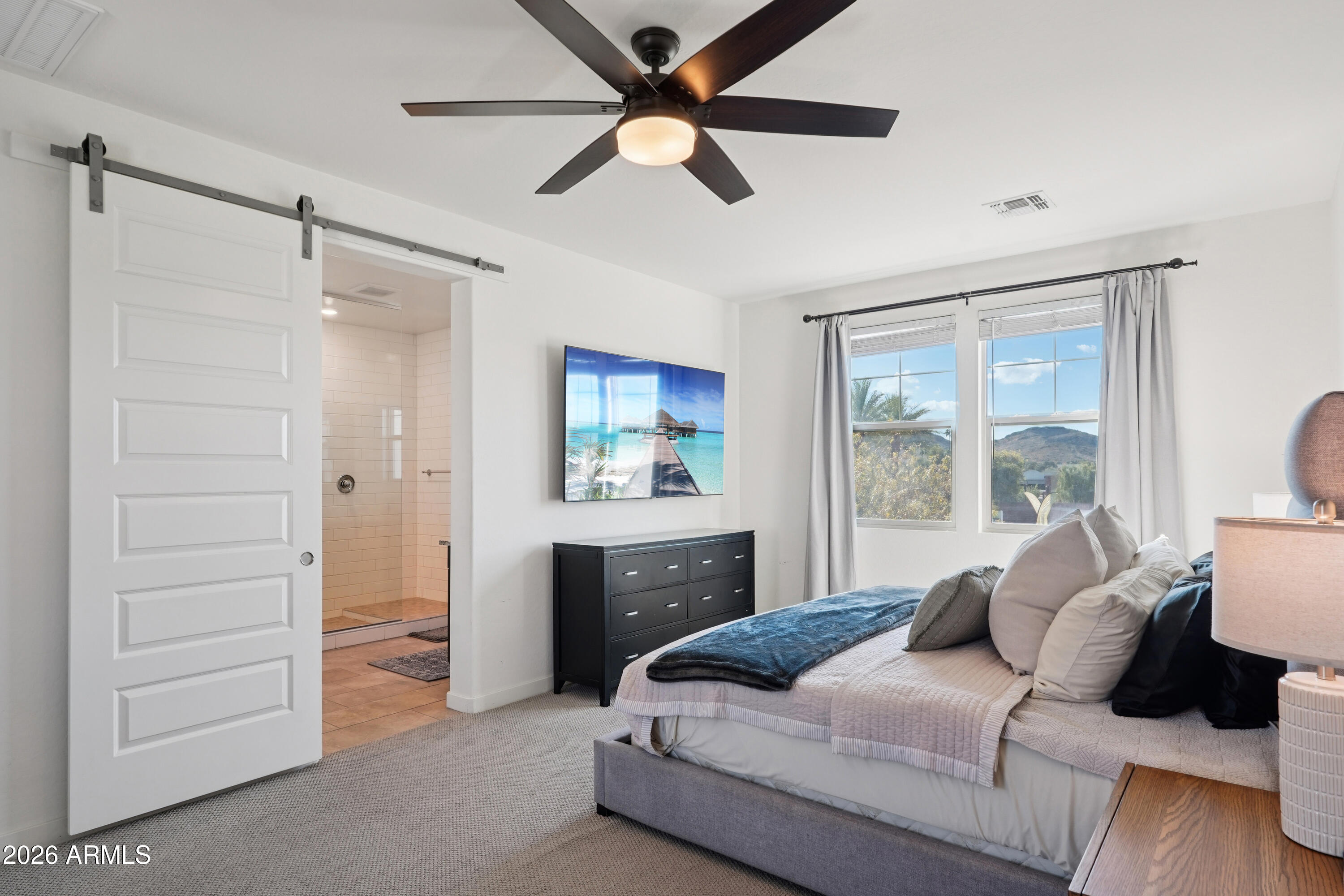 17153 North 10th Street Phoenix, AZ 85022 - Photo 27 of 48 a bedroom with a bed and a dresser